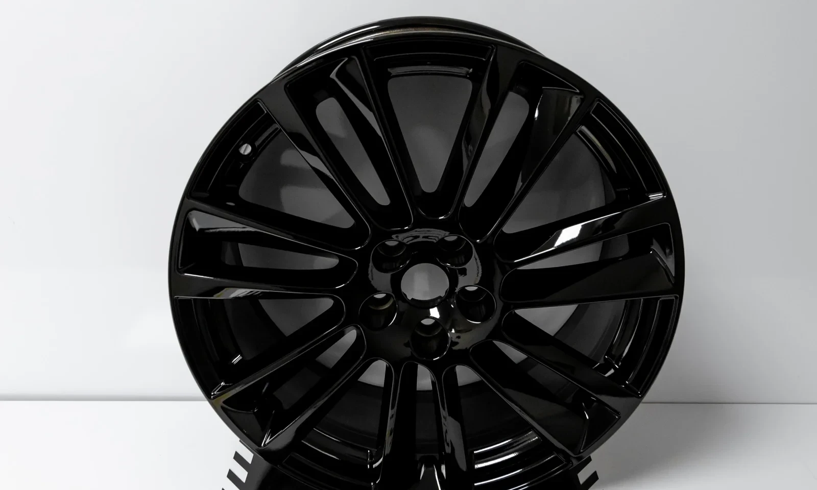 Jaguar F-Pace alloy refurbishment — gloss black finish